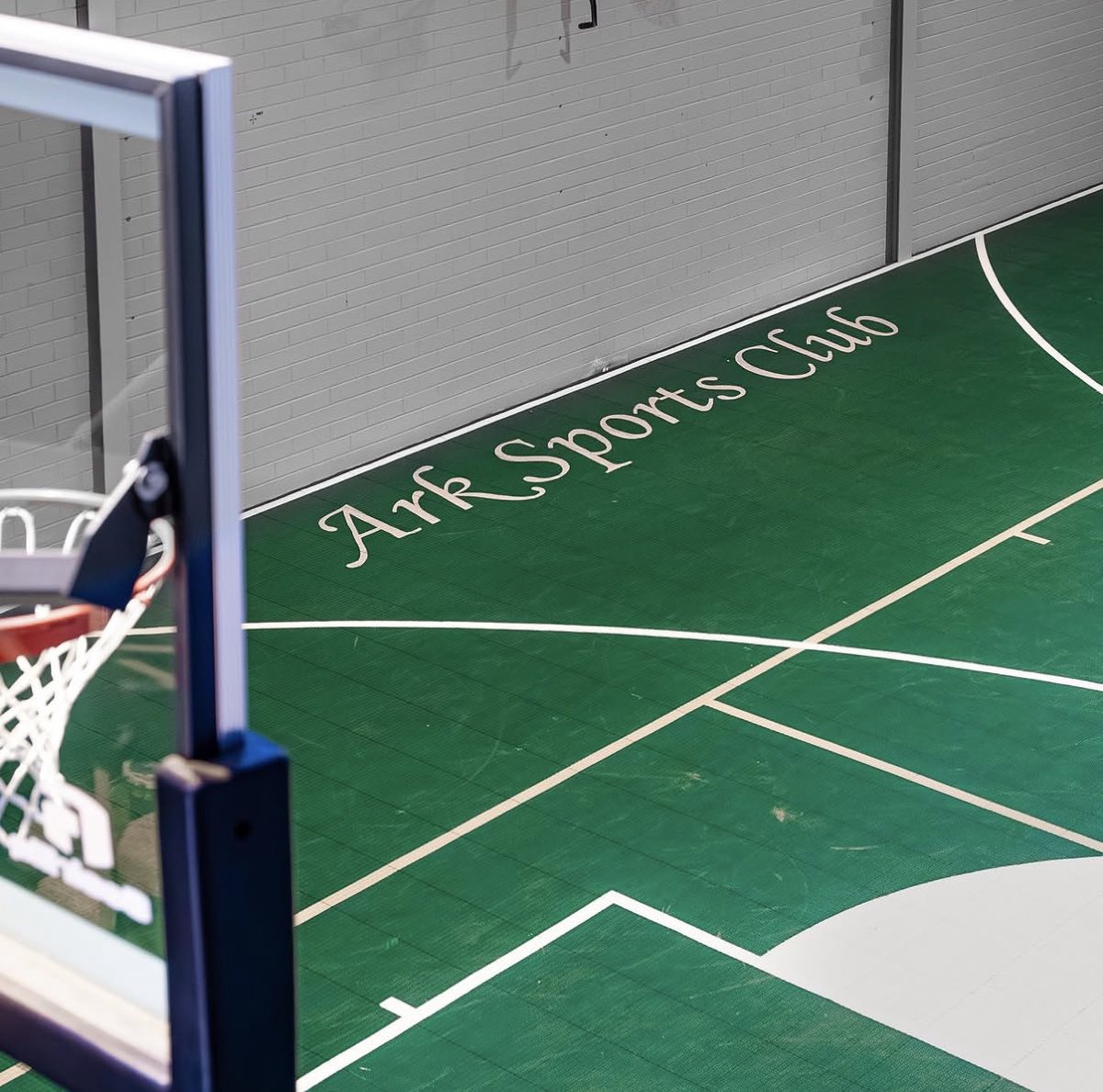 The Ark Sports Club script painted on the indoor court